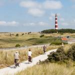 People cycling in dunes of Ameland, Netherlands