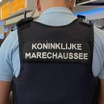 A Marechaussee officer walking through Schiphol Airport. 19 July 2024