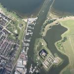  The sun shines over the Muiderslot, Muiden, Weesp, and the IJmeer in Noord-Holland. 11 August 2024