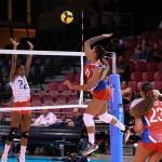 Cuba's Ellemay Tejeda attempts to spike the ball against Costa Rica's 