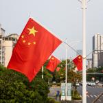 Chinese National flag hanging at the street lamp during holidays in Longgang, Shenzhen, China.