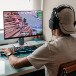 A teenager playing Fortnite on a PC