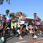 Runners past the De Gooyer windmill on their way from Amsterdam Oost into the city center during the 2017 Amsterdam Marathon. 15 October 2017