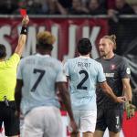 FC Twente goalkeeper Lars Unnerstall receives the red card from referee Nikola Dabanovic during the UEFA Europa League match between FC Twente and S.S Lazio Roma at Stadion De Grolsch Veste on October 24, 2024 in Enschede, Netherlands.