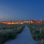 Sunset with the blue hour in Katwijk aan Zee with walking path from the dunes to the boulevard, 11 June 2022