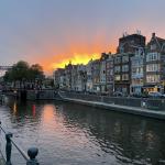 Sun setting over Schippersgracht in the Amsterdam city center. 9 October 2024
