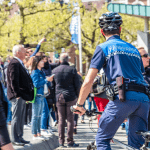 An enforcement officer in a crowd in Amsterdam
