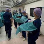 An extensive team of doctors and nurses prepare to deliver quadruplets. Oct. 2024