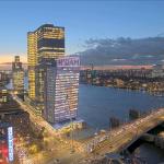 Clouds pass over Rotterdam at Dusk as traffic builds on the Erasmus Bridge. 26 November 2024.