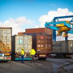 Stock image of workers at the Neuss Trimodal terminal along the Rijn River outside Dusseldorf, Germany