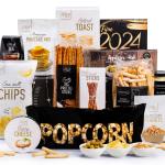 A Christmas Hamper stuffed with olives, finger food, snacks, cheese spread, aioli, tea, and even pancake mix