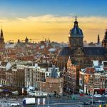 Amsterdam's skyline at sunset