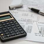 A calculator along with investment and finance projections