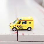 A toy ambulance with a similar color scheme as those used in the Netherlands