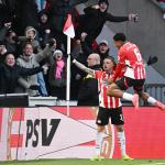 Noa Lang of PSV Eindhoven, Ryan Flamingo of PSV Eindhoven celebrate the 1-0 during the Dutch Eredivisie match between PSV Eindhoven and Feyenoord Rotterdam at Phillips Stadium on December 22, 2024 in Eindhoven, Netherlands.