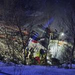 Members of the emergency services work after a bus went off the road on the E10 and plunged into a lake in Hadsel, Nordland, Norway, 26 December 2024. At least three people have died and four are seriously injured, according to police. 