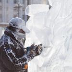 A man carves an ice sculpture