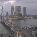 The sun breaks through the clouds as storm force winds sweep past Rotterdam. 6 Dec. 2024