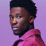 Claude Kiambe, better known only by his first name, during a photoshoot to announce the Dutch entry for the 2025 Eurovision Song Contest