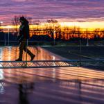 An ice master inspects the newly formed ice surface from a footbridge. The sprayed ice rink at the Winterswijkse IJsvereniging is among the first to open for skating after just a few nights of frost. 14 Jan. 2026