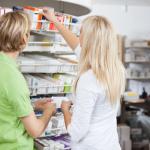 A pharmacy assistant is at work.