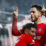 Naci Unuvar of FC Twente, Ricky van Wolfswinkel of FC Twente celebrate the 2-1 during the Europa League play-off match between FC Twente and Bodo/Glimt at Stadion De Grolsch Veste on February 13, 2025 in Enschede, Netherlands.