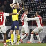 Ross Sykes of Royale Union Saint-Gilloise is disappointed, Kenneth Taylor of Ajax, Jordan Henderson of Ajax celebrate during the Europa League play-off match between Ajax Amsterdam and Union SG at the Johan Cruijff ArenA on February 20, 2025 in Amsterdam, Netherlands.