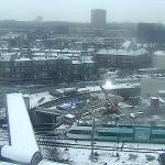 An Arriva train passes by the Groningen Station while construction workers carry out renovation work in the cold and snow. 13 February 2025