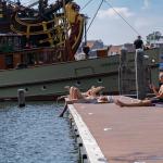 People sunbathing at the Marineterrein's inner harbour.
