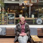 Neil Robinson sits outside Cafe de Knoop