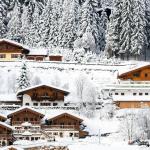 Snow covered hotels near a ski piste in Flachau, Austria