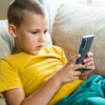 Young boy using a smartphone