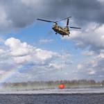 A Dutch military Chinook helicopter collecting thousands of liters of water in a Bambi Bucket during a drill in Amersfoort. 19 March 2024