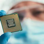 Engineer holds a microchip.