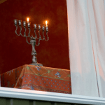 Hanukkah menorah on the first day of Hanukkah - symbols of the Jewish faith