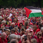 Protesters dressed in red march through The Hague to draw a symbolic "red line" against the Dutch cabinet’s stance on Israel. Organizers estimated the crowd exceeded 100,000, calling it the largest demonstration in the Netherlands in 20 years, May 18, 2025.