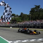 Red Bull Racing's Dutch driver Max Verstappen crosses the finish line in first place during the 2025 Emilia Romagna Formula One Grand Prix at the Imola autodrome in Imola, on May 18, 2025.