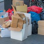 Cardboard boxes and garbage bags on the street