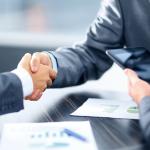 Businessmen shake hands