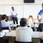 Teacher and students during a university lecture.