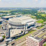 An aerial view over the Johan Cruijff ArenA and ING’s Amsterdam-Zuidoost headquarters, looking towards the Strandvliet metro stop, and Duivendrecht in Ouder-Amstel.