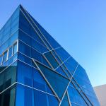 Stock image of a glass building on a sunny day