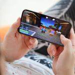 A child playing Roblox on an iPhone 15