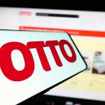 Otto logo displayed on a screen in front of the company’s open website