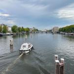 Looking north on the Amstel River from Nieuwe Amstelbrug on a hot day in Amsterdam.  12 Aug 2025