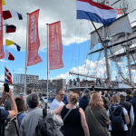 SAIL Amsterdam: People queuing on the quays of Amsterdam for their chance to board a tall ship, 21 August 2025