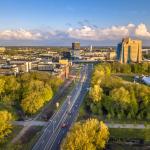 Aerial view west along the N7 in Groningen towards the N370, flanked on the left by the Stadspark Hotel, and on the right by the Gasunie headquarters building. 2019
