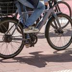 A person is riding an electric bicycle