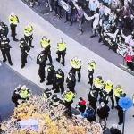 Riot police keep anti-asylum and anti-fascism protesters apart in Amersfoort, 30 September 2025