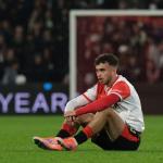 Feyenoord's Aymen Sliti sits on the pitch at the end of the Europa League opening phase soccer match between Feyenoord and Aston Villa at the Feyenoord "De Kuip" stadium in Rotterdam, Netherlands, Thursday, Oct. 2, 2025.